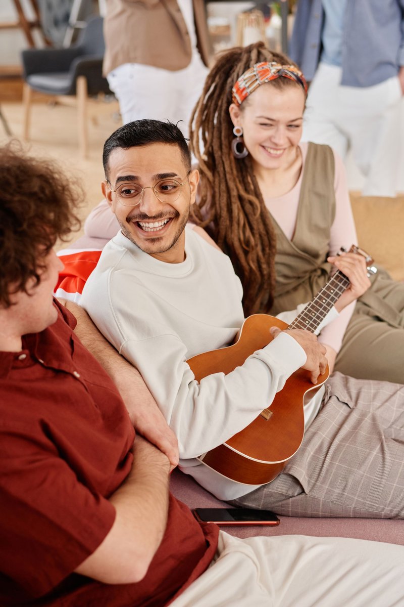 Diverse residents connecting and making music together at Life Changing Living